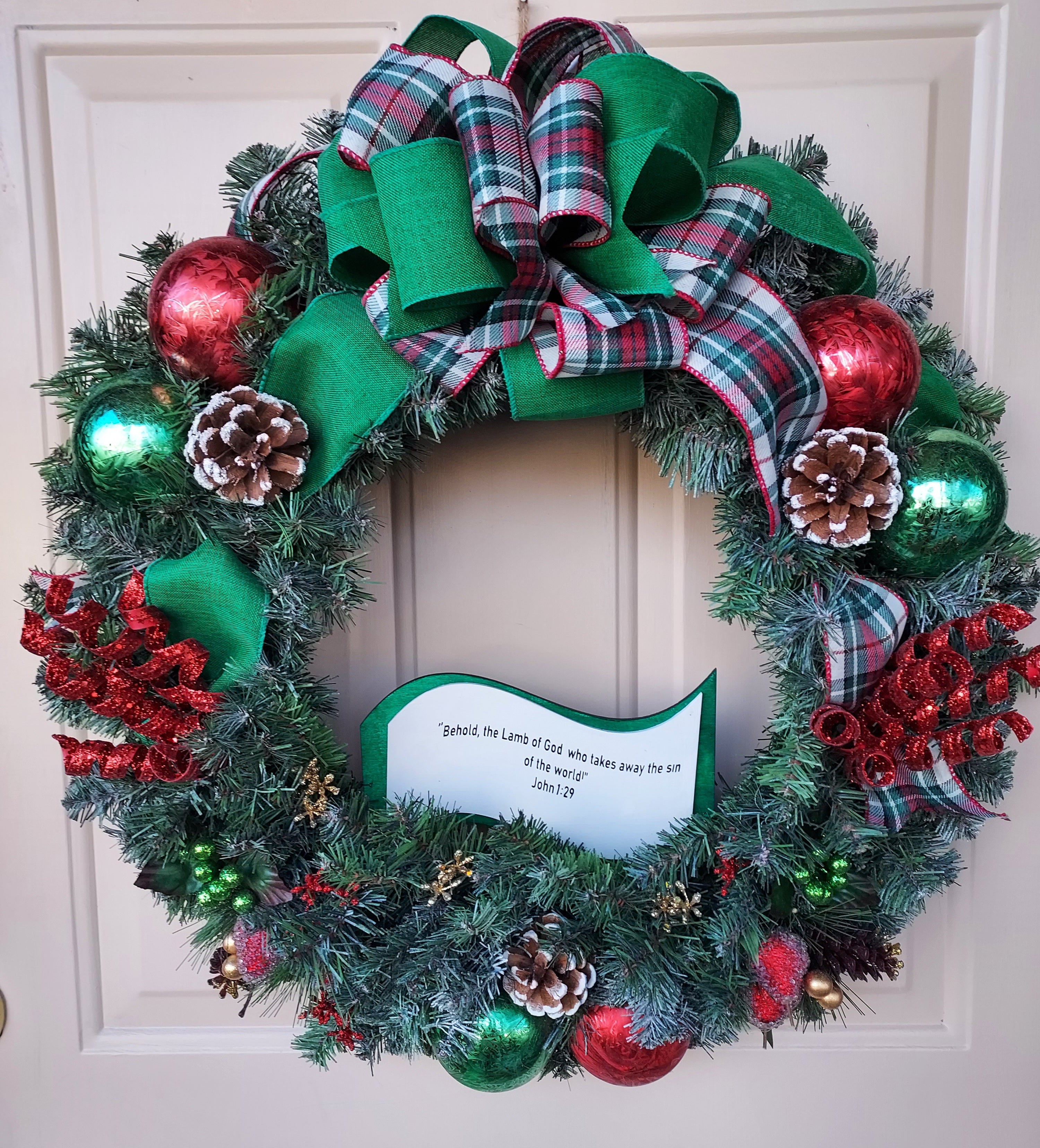 Lighted Christmas Artificial Pine Wreath with Green and Red Trimmings and Plaid Bow, Infused with Bible Scripture