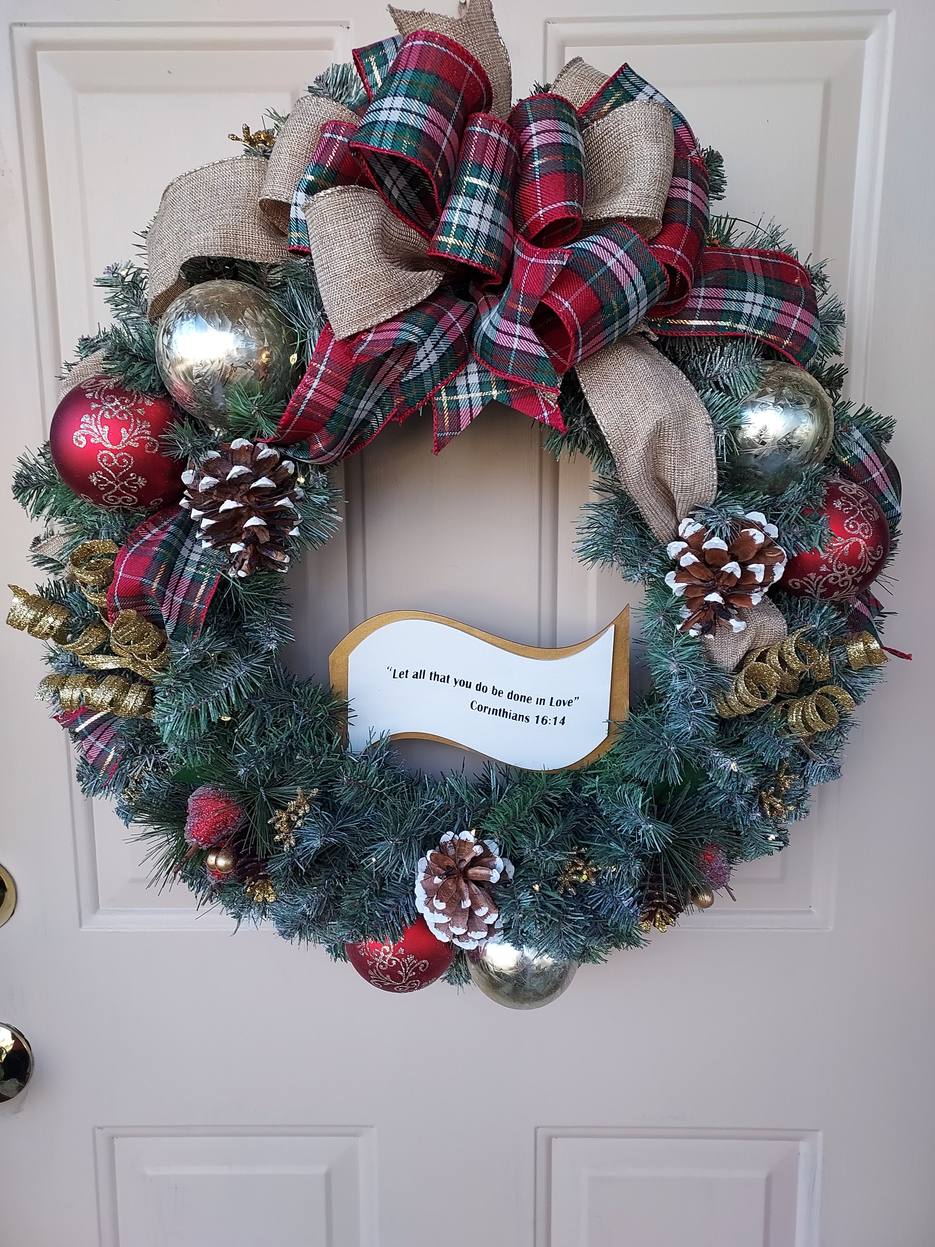 Lighted Christmas Artificial Pine Wreath with Green, and Red Bulbs, Accented with a Plaid Bow, Infused with Bible